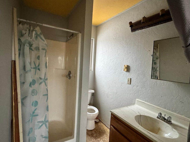 bathroom with a shower with curtain, vanity, toilet, and wood-type flooring