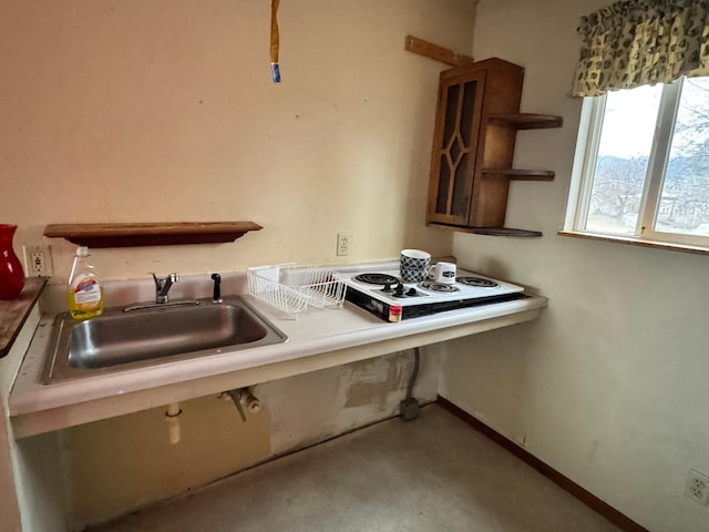 kitchen with sink and white stovetop