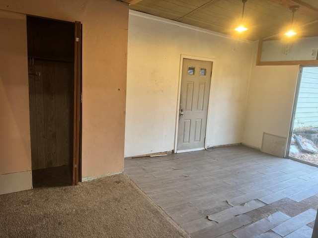 unfurnished room featuring light hardwood / wood-style flooring and wooden ceiling