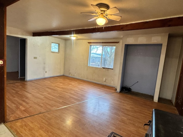 interior space with ceiling fan and light wood-type flooring