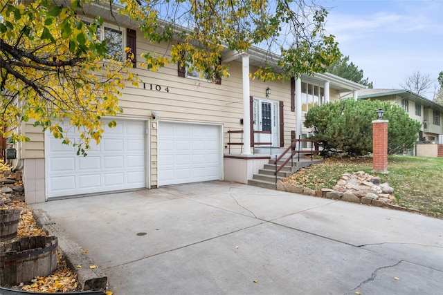 raised ranch featuring a garage