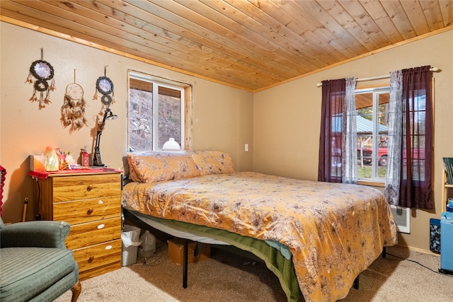 carpeted bedroom featuring wooden ceiling, ornamental molding, and vaulted ceiling