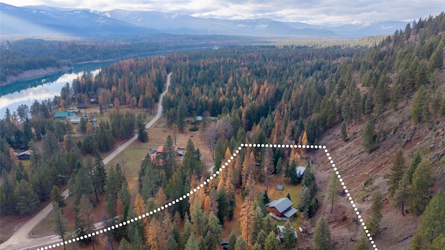 aerial view featuring a water and mountain view