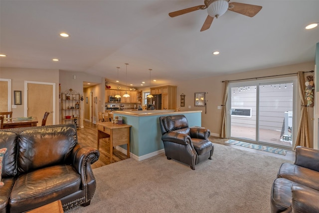 living room featuring ceiling fan, light carpet, and vaulted ceiling