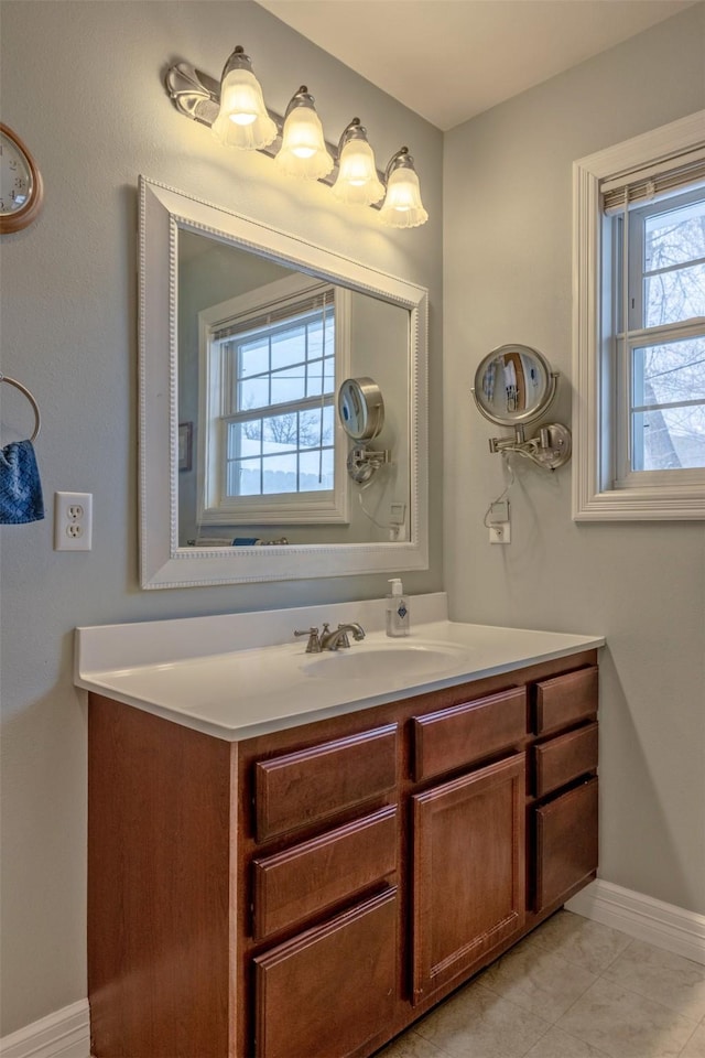 bathroom with tile patterned flooring and vanity