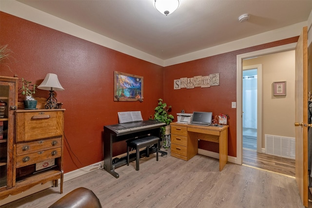 home office featuring light hardwood / wood-style flooring