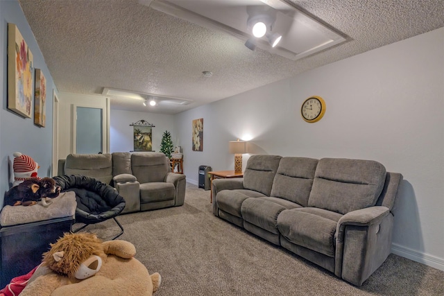 carpeted living room with a textured ceiling