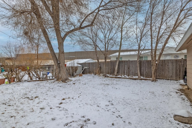 view of yard layered in snow