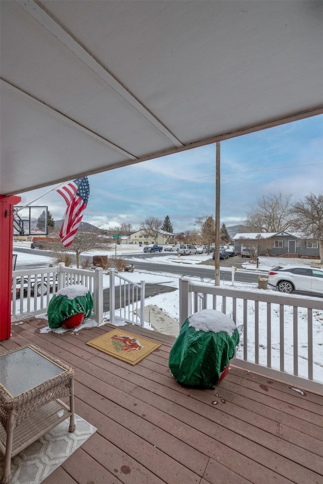 view of snow covered deck