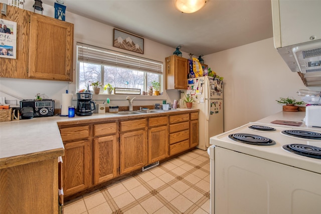 kitchen with sink and white appliances