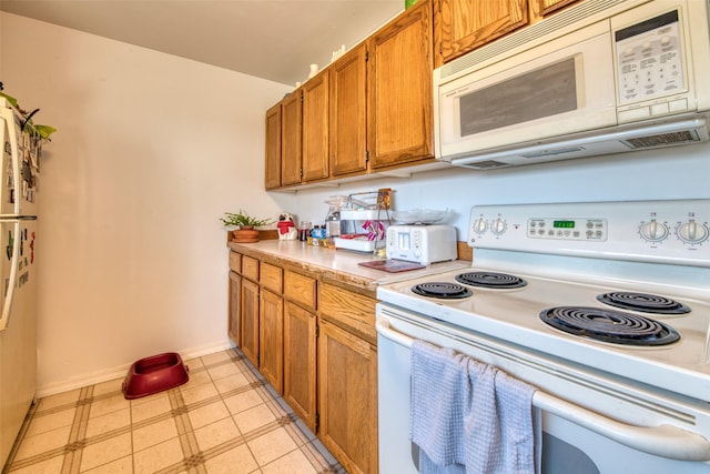 kitchen featuring white appliances