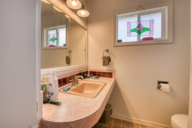 bathroom featuring sink and toilet