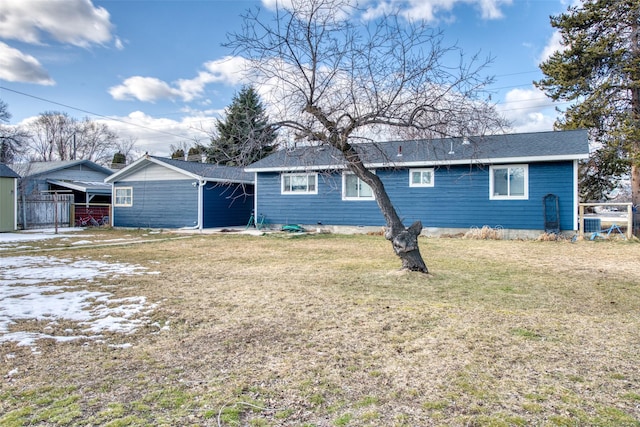 back of house with a yard