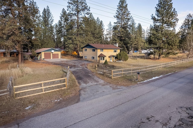 view of front of property with an outbuilding and a garage