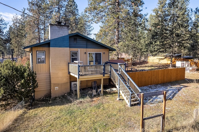 back of house with a wooden deck