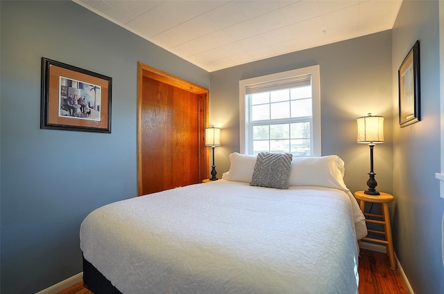 bedroom featuring dark hardwood / wood-style floors