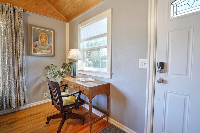 office with hardwood / wood-style floors, plenty of natural light, wooden ceiling, and lofted ceiling