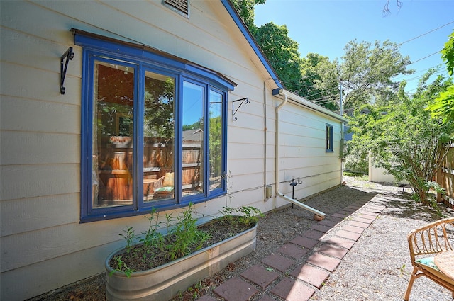 view of side of property featuring a patio