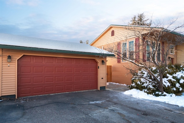 view of snow covered garage