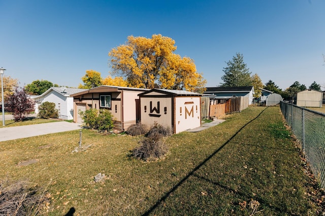 view of side of home featuring a yard