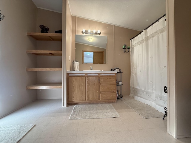 full bathroom featuring curtained shower, vaulted ceiling, vanity, and tile patterned floors