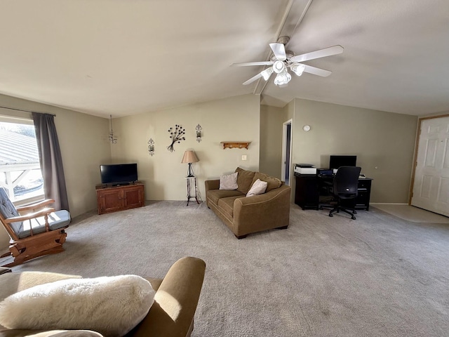 living room with carpet flooring, vaulted ceiling, and ceiling fan