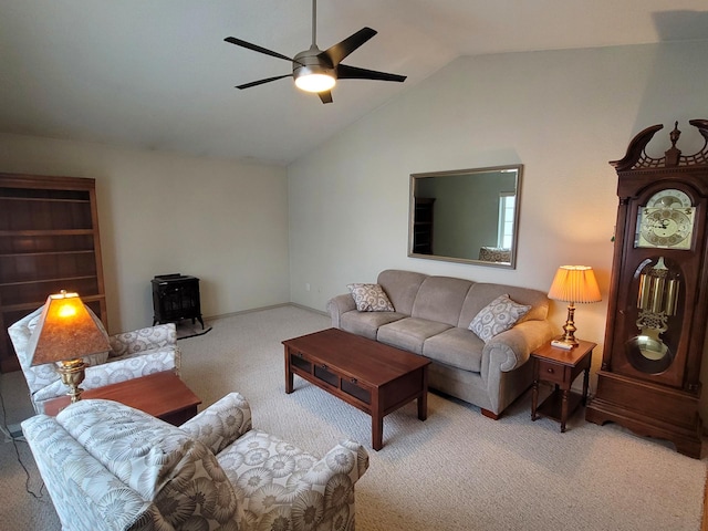 living room with carpet flooring, vaulted ceiling, and ceiling fan