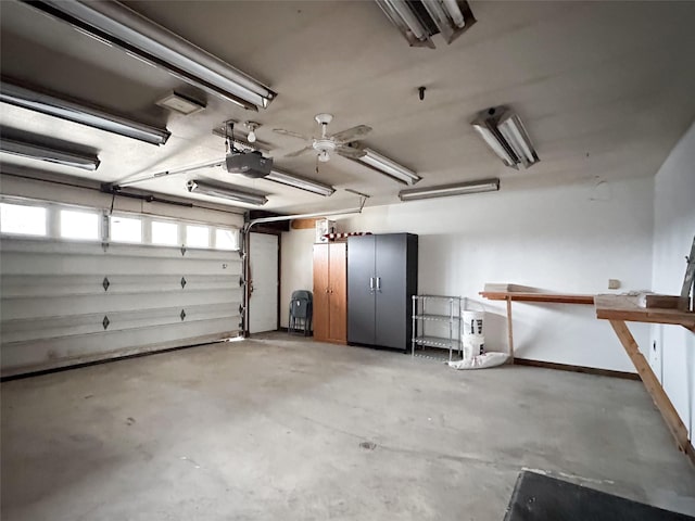 garage with ceiling fan and a garage door opener