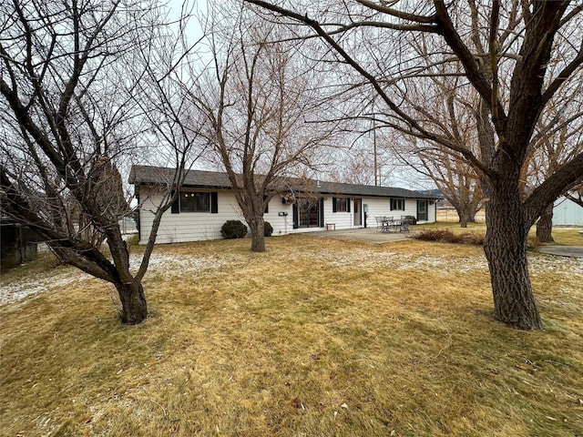 single story home with a patio area and a front yard