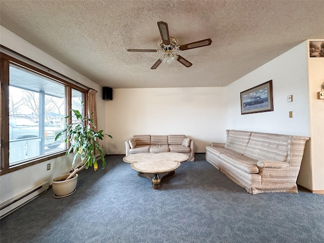 unfurnished living room with ceiling fan, carpet floors, a baseboard radiator, and a textured ceiling