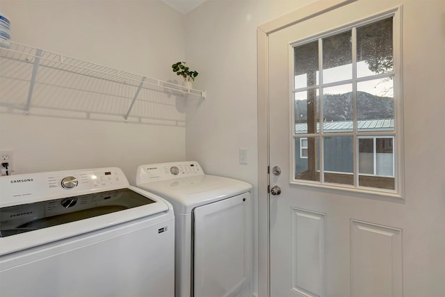 laundry area with a mountain view and washer and clothes dryer