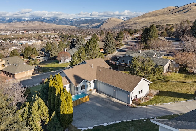 birds eye view of property with a mountain view