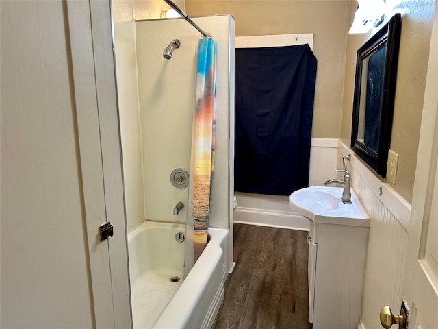 full bathroom featuring vanity, wood-type flooring, shower / bath combo, and toilet