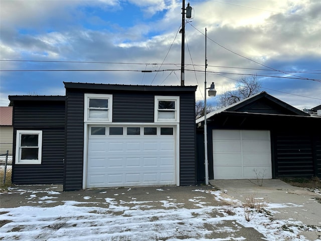 view of snow covered garage