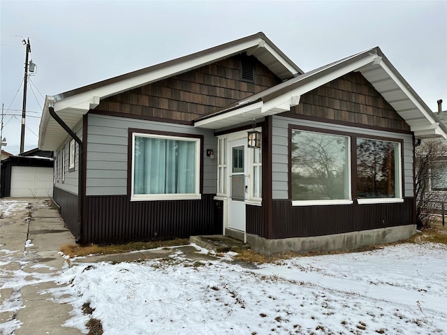 view of front of house with an outbuilding and a garage