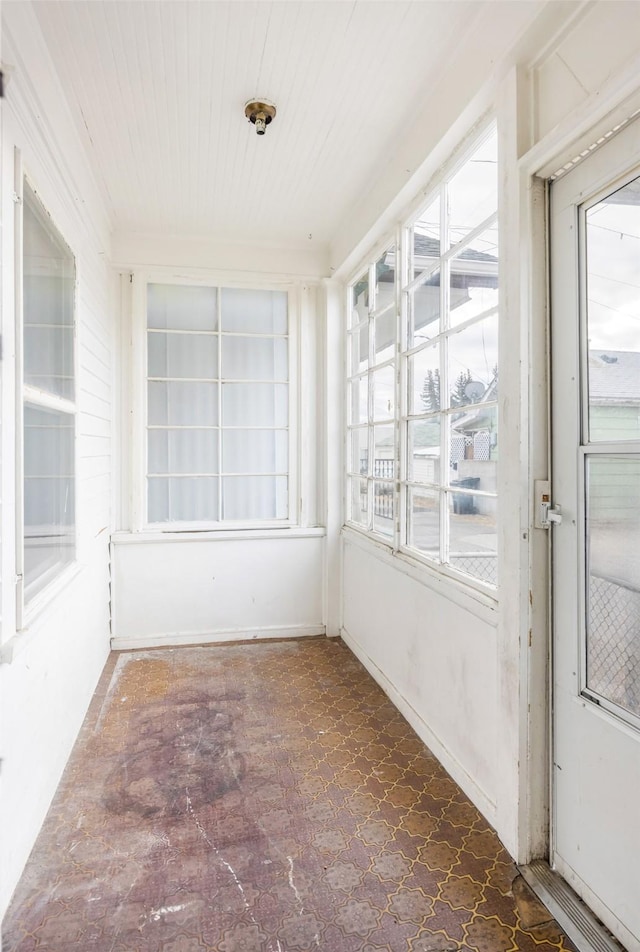 unfurnished sunroom featuring a healthy amount of sunlight