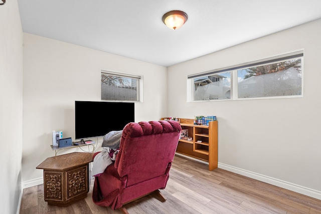 home office with hardwood / wood-style flooring