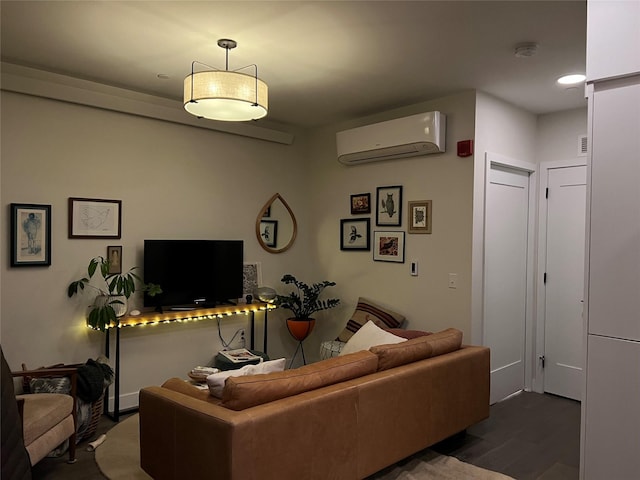 living room with dark hardwood / wood-style flooring and a wall unit AC