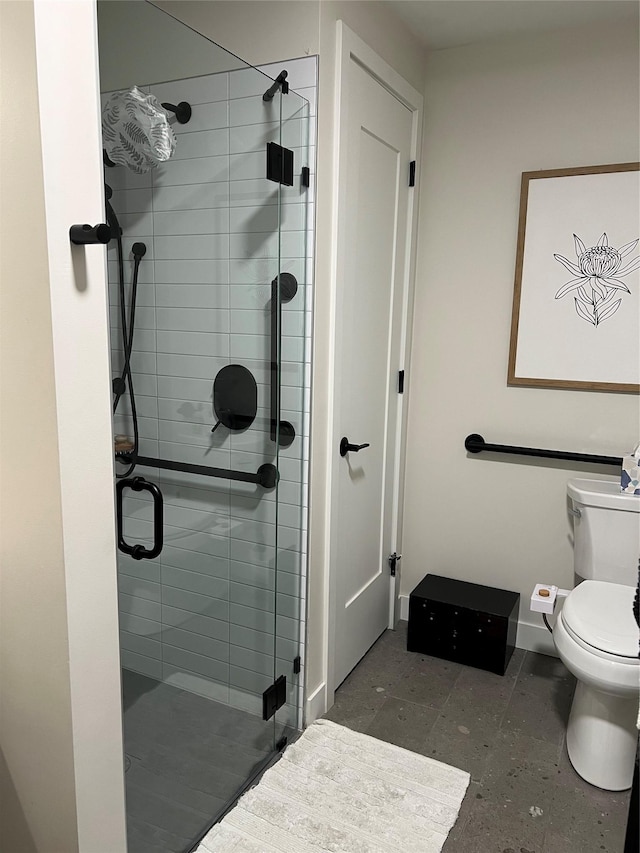 bathroom featuring toilet and walk in shower