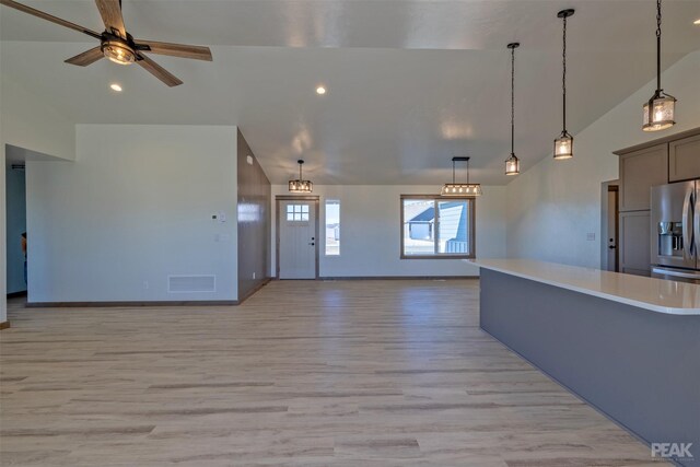 foyer featuring an inviting chandelier and light hardwood / wood-style flooring