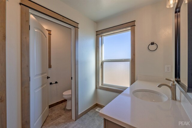 bathroom with a tile shower and sink