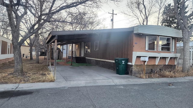 view of side of property with a carport