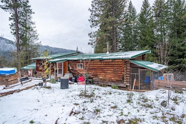 snow covered property with a mountain view