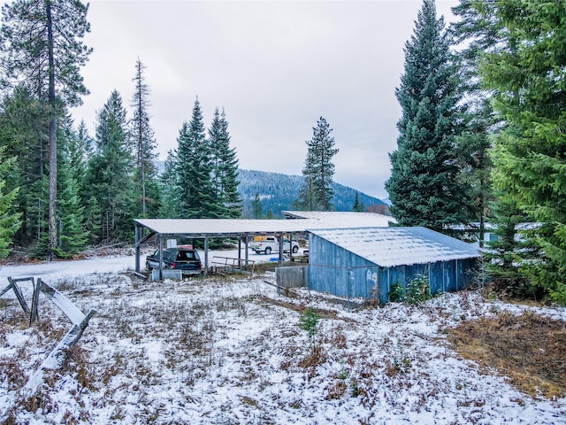 exterior space featuring a carport and a mountain view