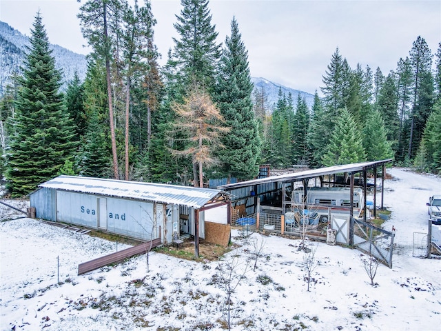 exterior space featuring a mountain view and an outdoor structure