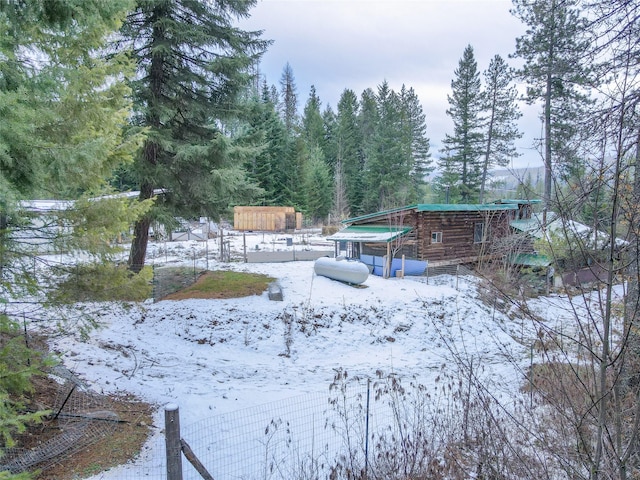 view of yard covered in snow