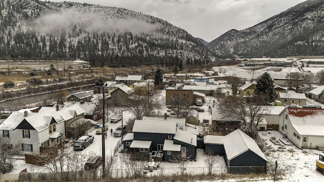 snowy aerial view with a mountain view