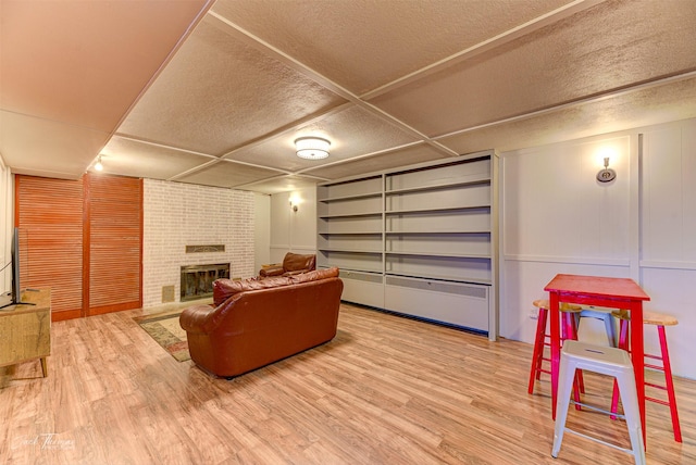 interior space with a fireplace and wood finished floors