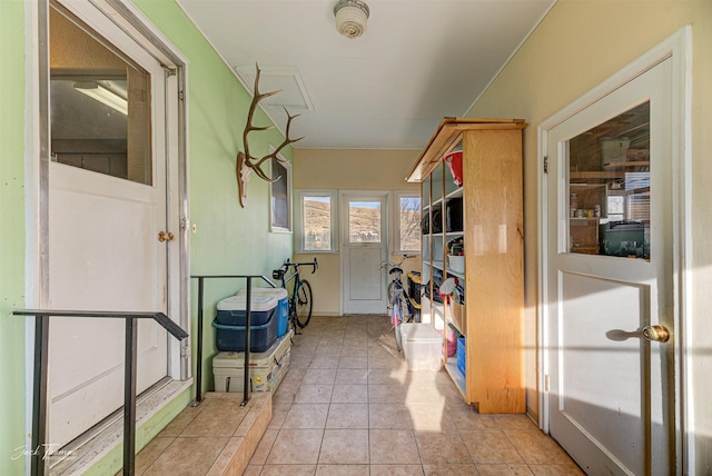 hallway with light tile patterned floors