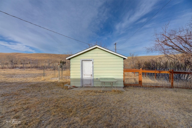 view of shed with fence